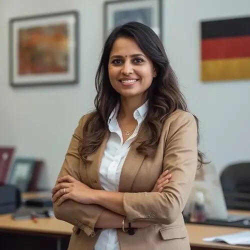 anjali, an Indian advisor, wearing a traditional German costume, standing in front of her desk with more German elements in the background, such as German decor or cultural items._1