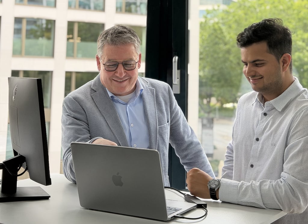A NEOdirect advisor walking a client through insurance options on a laptop