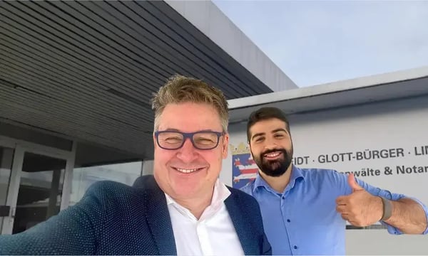 Martin and Firat taking a selfie in front of the notary’s office in 2022, when NEOdirect was founded