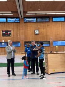 Martin presenting a sponsorship trophy to the St. Ingbert Indian cricket team in 2023
