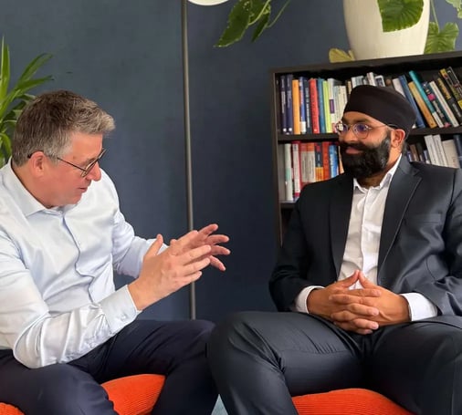 A NEOdirect adviser in conversation with a client in the office