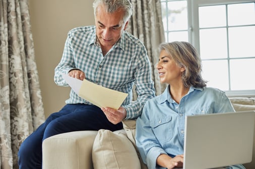 Couple reviewing their pension documents at home