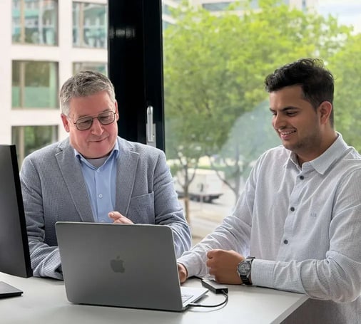 A NEOdirect advisor and a client reviewing insurance options together on a laptop
