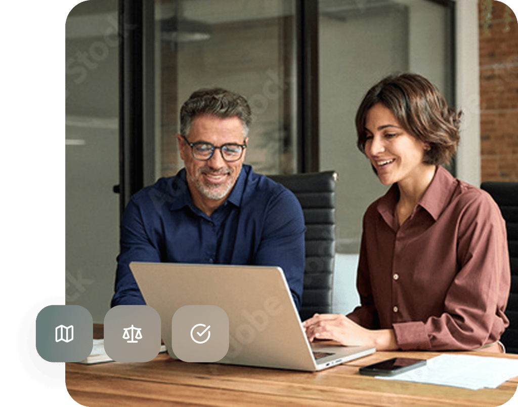A client and adviser reviewing documents together at a laptop beside a legal scales icon