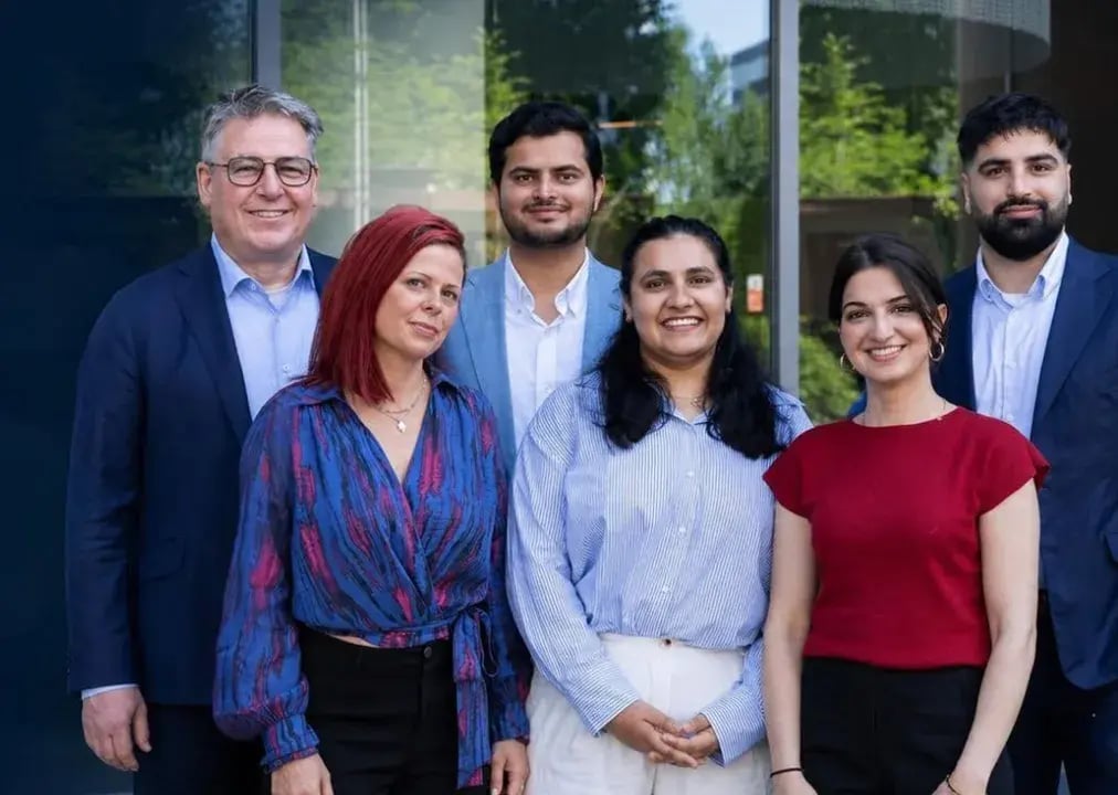 The NEOdirect team — six advisers standing together outside the office